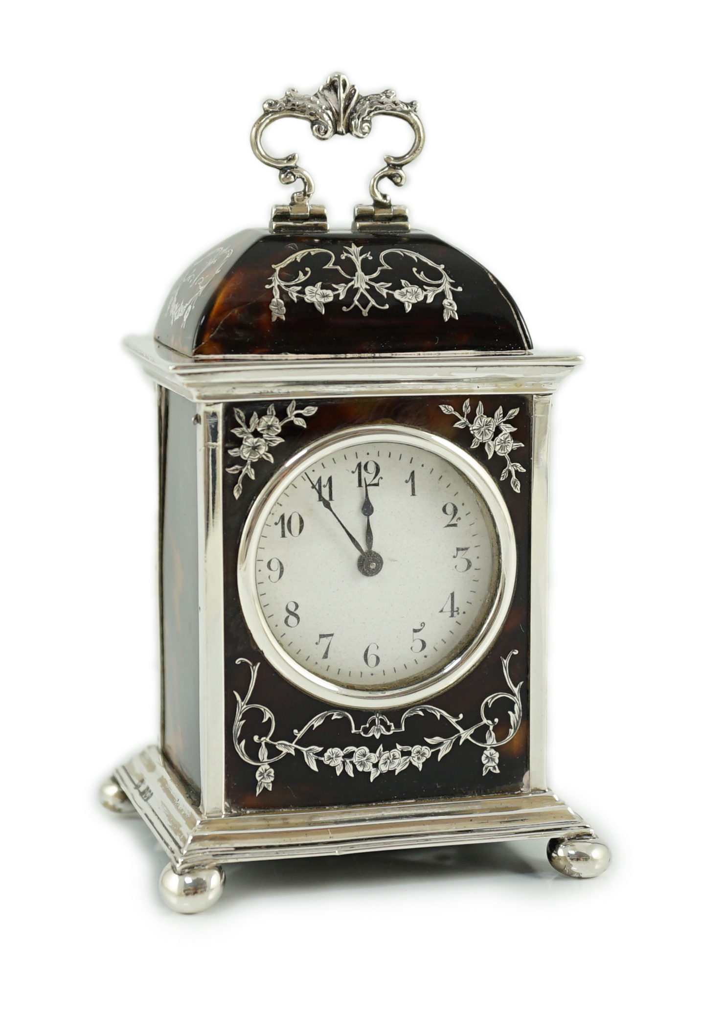 A George V silver and tortoiseshell pique mounted carriage timepiece, by William Comyns